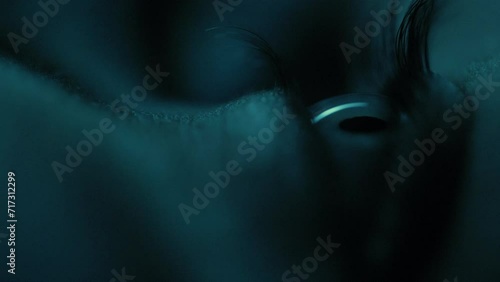 Male Eye Opening Super Macro Closeup at Night Blue Light photo