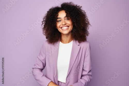 Portrait of a smiling african american businesswoman over purple background