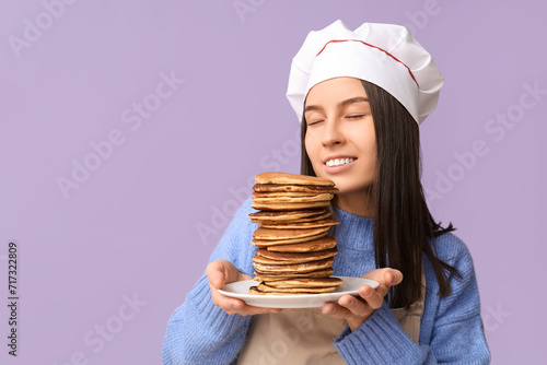 Young female chef with tast...