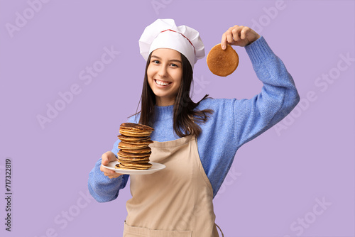 Young female chef with tast...