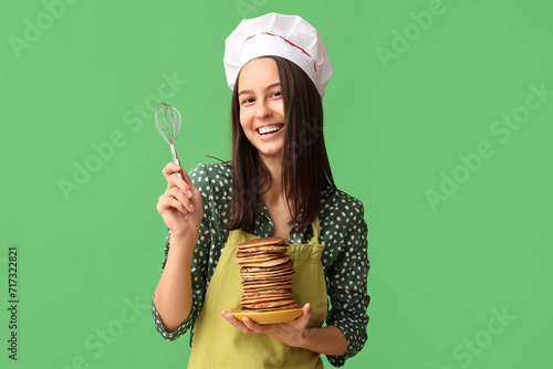 Young female chef with tast...