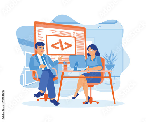 Two young designers work at a software development company. Developing programming and coding technology on computers. Software developers concept. Flat vector illustration. © berkah design