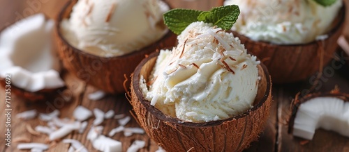 Selective focus on coconut ice cream served in a coconut shell.