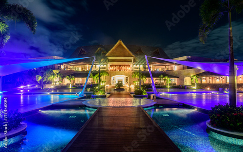 Canvas Print Resort pools at night with clouds and stars