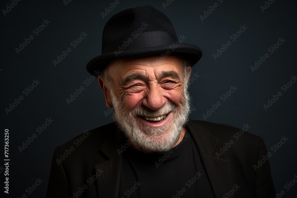 Portrait of an old man in a hat on a dark background Portrait of an old man in a hat on a dark background
