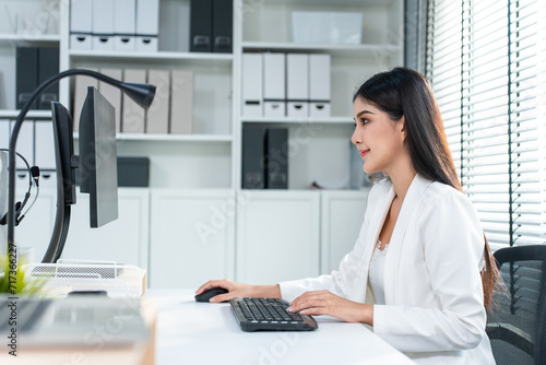 Asian beautiful businesswoman using laptop computer working in office. 