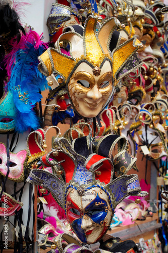 Colorful masks for sale at the Venetian Carnival displayed on a street in Venice.