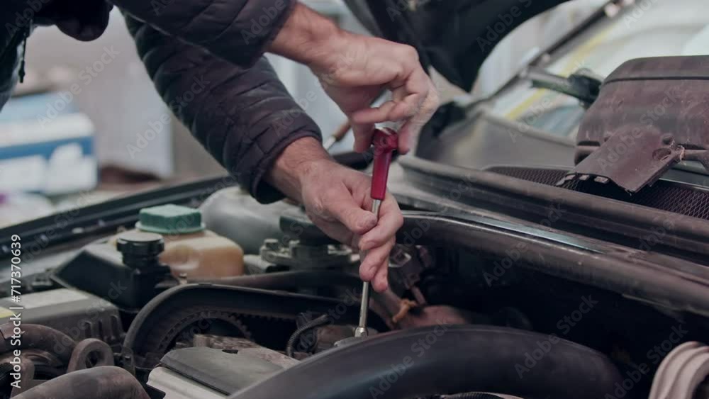 Repair of a Malfunctioning Car Engine with a Socket Wrench Footage. Repair of a Malfunctioning Car Engine with a Socket Wrench Footage.