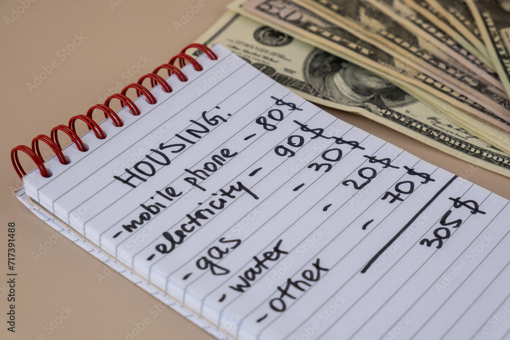 Counting receipt for utilities payment. Dollars cash money Electricity water gas price. Conservative consumption insecurity economic crisis concept. Increasing higher prices Counting receipt for utilities payment. Dollars cash money Electricity water gas price. Conservative consumption insecurity economic crisis concept. Increasing higher prices