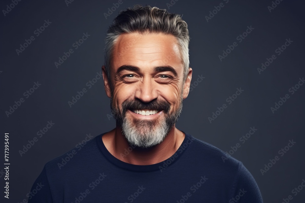 Portrait of a handsome mature man smiling and looking at camera. Portrait of a handsome mature man smiling and looking at camera.