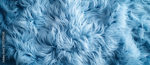 Close-up texture of fluffy blue fabric for furniture material.