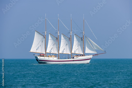A beautiful white sail tour boat in the lake Michigan.