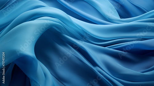 Abstract Fabric Waves invites you into a world of mesmerizing textile artistry  where shadow and light engage in a dance upon the rippling surface of blue fabric. This unique and captivating compositi