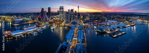 Panoramic view of Auckland city skyline and waterfront at dusk photo