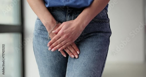 Pain due to bowel incontinence and woman hand holds perineum