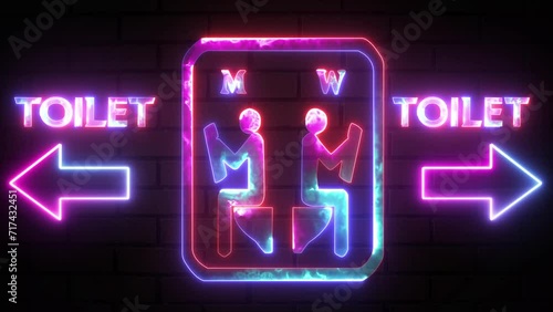 Sitting and read paper in toilet neon sign on bricks wall background. In and out sign. Restroom male and female arrow pointer, silhouette of a man and a woman photo