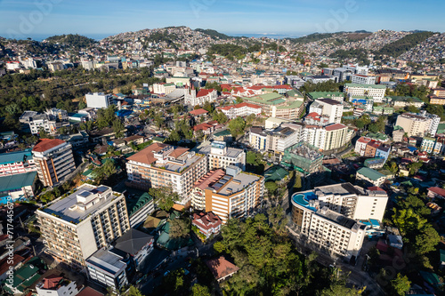 Baguio City, Philippines - An expansive aerial shot capturing the dense architecture and vibrant life of a bustling mountainous city.