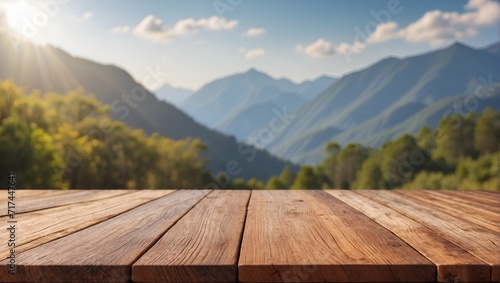 Empty wooden table on defocused blurred mountain background.