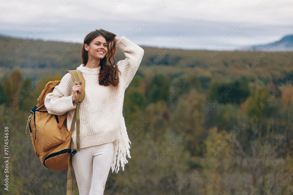 Mountain Adventure: Smiling Woman on Cliff Mountain Adventure: Smiling Woman on Cliff