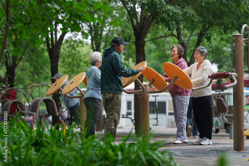 Old people who exercise with exercise equipment in the park