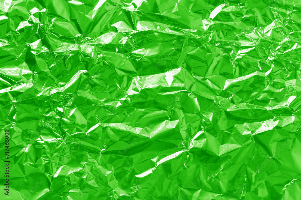 Shiny green lime foil texture background, pattern of wrapping paper with crumpled and wavy. Shiny green lime foil texture background, pattern of wrapping paper with crumpled and wavy.