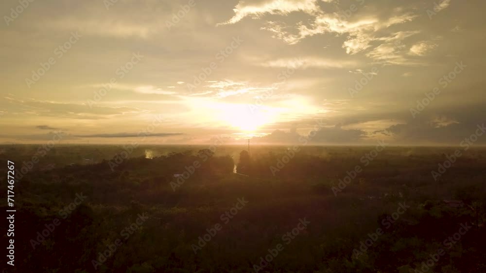 Golden Hour Horizon: A serene and breathtaking aerial view of a sunrise over a vast, misty landscape. The golden light bathes the horizon in a warm glow, creating a sense of peace and tranquility. Golden Hour Horizon: A serene and breathtaking aerial view of a sunrise over a vast, misty landscape. The golden light bathes the horizon in a warm glow, creating a sense of peace and tranquility.