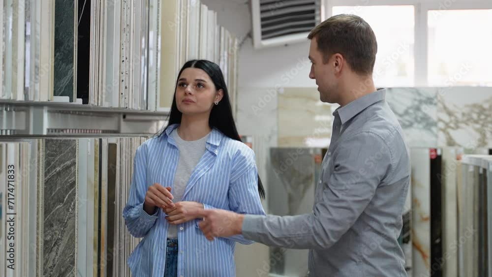 Bride and groom choosing ceramic tiles Bride and groom choosing ceramic tiles