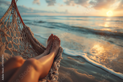 Woman legs barefoot in a sandy beach photo