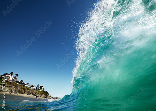 View of a wave from the water with the crest curling over.