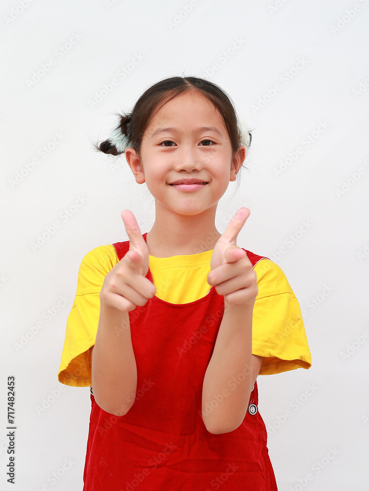 Portrait of Asian young girl kid pointing straight at you on white background. Portrait of Asian young girl kid pointing straight at you on white background.