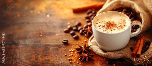 Morning coffee, a bag of Arabica, with milk and cinnamon, brings cheer, energy, lacey background; cappuccino or espresso.