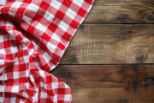 Napkin on rustic table with red checkered cloth