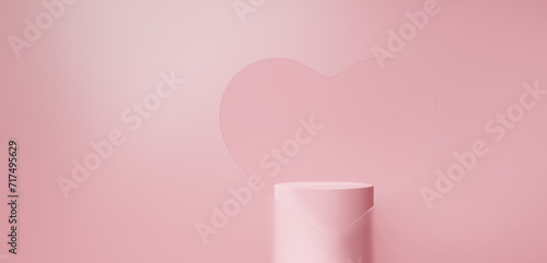 ピンク色の背景に台座。ハート型にくりぬいたガラス。コピースペース。（横長） photo