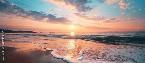 Photo of a serene sunrise by the sea.