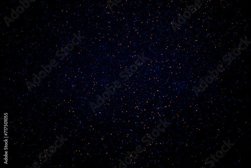 Red and blue sparks on a dark background