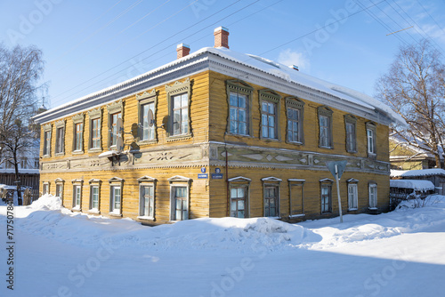 Old wooden residential building (late 19th century) on a sunny February day, Kargopol