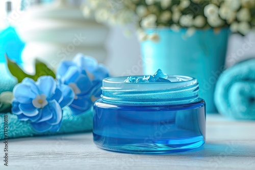 Blue jar of petroleum jelly for moisturizing and skincare photo