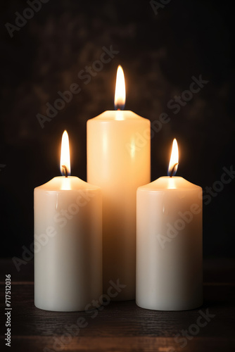 Several candles for lighting blessings are placed on the table