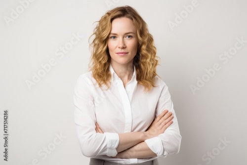 Portrait of a beautiful young business woman with curly blond hair.