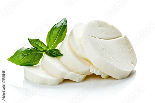 Isolated mozzarella cheese with basil leaf on white background