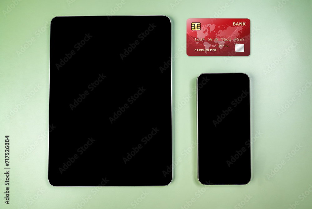 Credit cards and tablets with mobile phones with empty screens for mobile payment, banking, or online shopping Credit cards and tablets with mobile phones with empty screens for mobile payment, banking, or online shopping