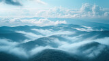 A mountaintop view where clouds and fog merge, blurring the horizon.