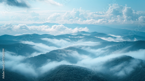 A mountaintop view where clouds and fog merge, blurring the horizon.