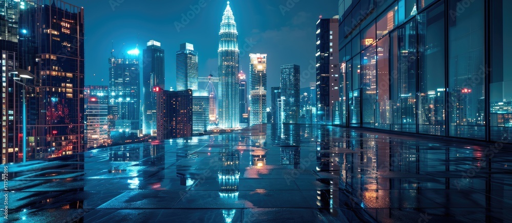 Fototapeta premium Night view of Kuala Lumpur city with empty floor. Copy space image. Place for adding text or design