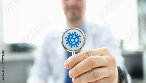 Doctor holds stethoscope infected with coronavirus. Fast-growing healthcare segment. Reduce number trips to doctor thanks to telemedicine. Determining prognosis disease during pandemic