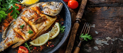 Grilled tilapia fish with a delicious blend of spices delicious to eat alone or with family. Copy space image. Place for adding text or design