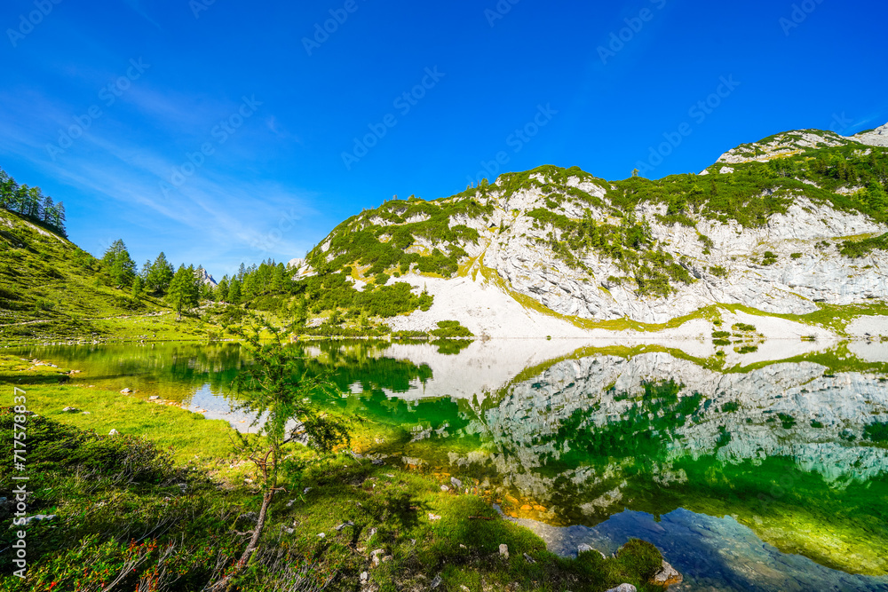 Schwarzensee on the high plateau of the Tauplitzalm. View of the lake at the Totes Gebirge in Styria. Idyllic landscape with mountains and a lake on the Tauplitz in Austria.
