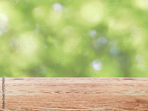  自然の緑が背景で木目のある木のテーブルの背景画像