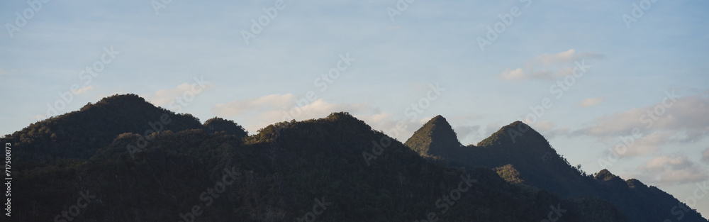 travel in nature concept with tropical forest on mountain and clear sky in springtime season