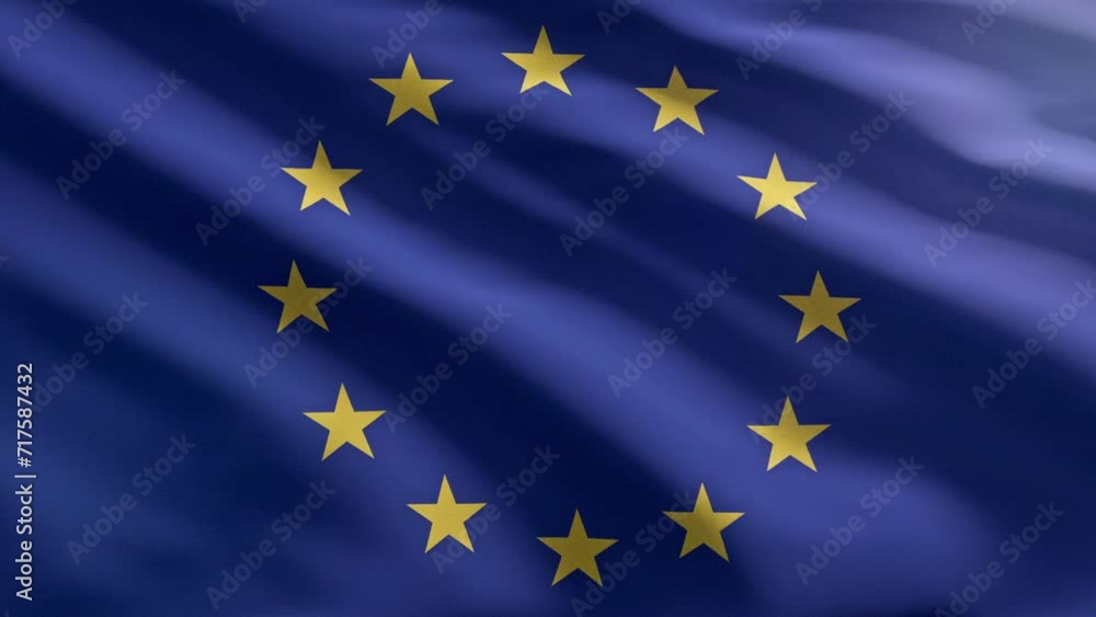 Waving the flag of the European Union. Wind shaking the European Union Flag with twelve yellow stars in the blue background. Flag representing the multiple members of the European Union. Waving the flag of the European Union. Wind shaking the European Union Flag with twelve yellow stars in the blue background. Flag representing the multiple members of the European Union.